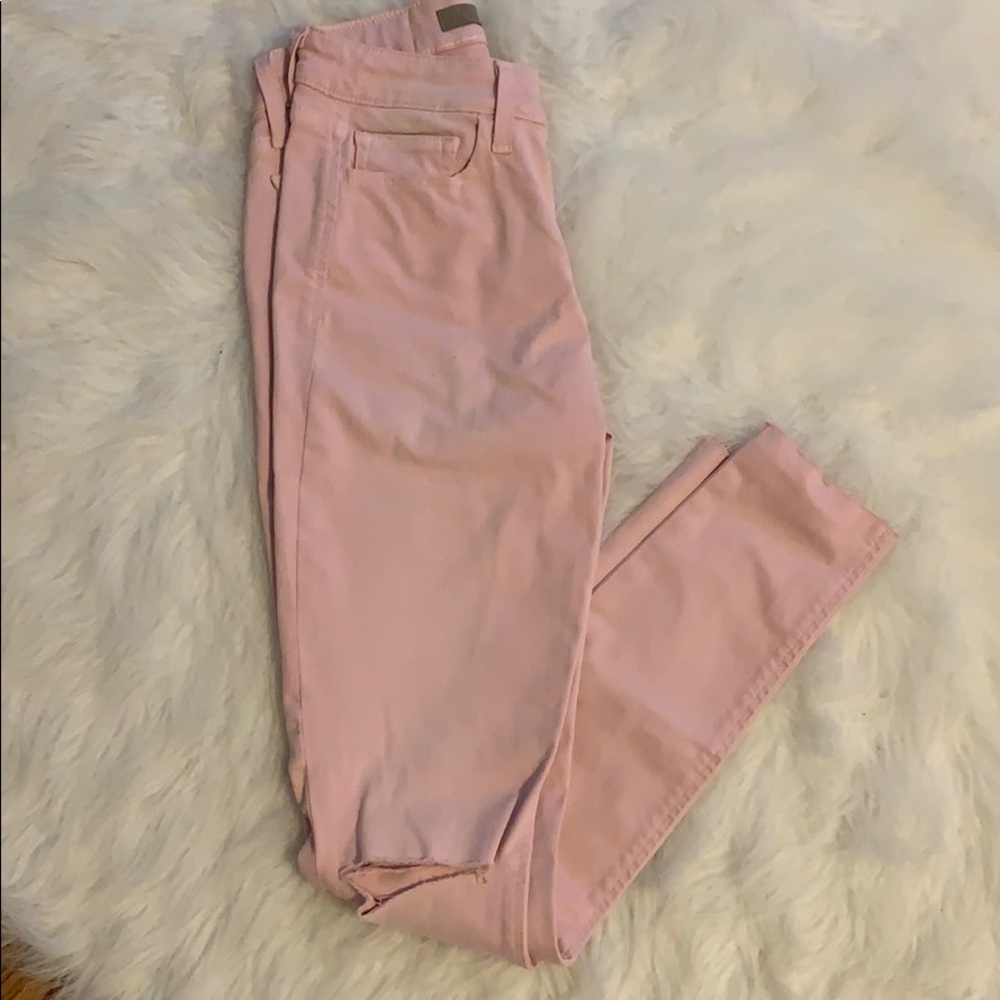 Pink ripped in the knee jeans